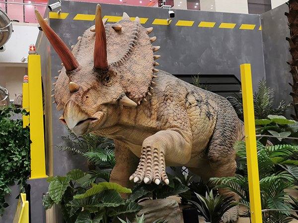 Animatronic Triceratops exhibit installed in a shopping mall atrium