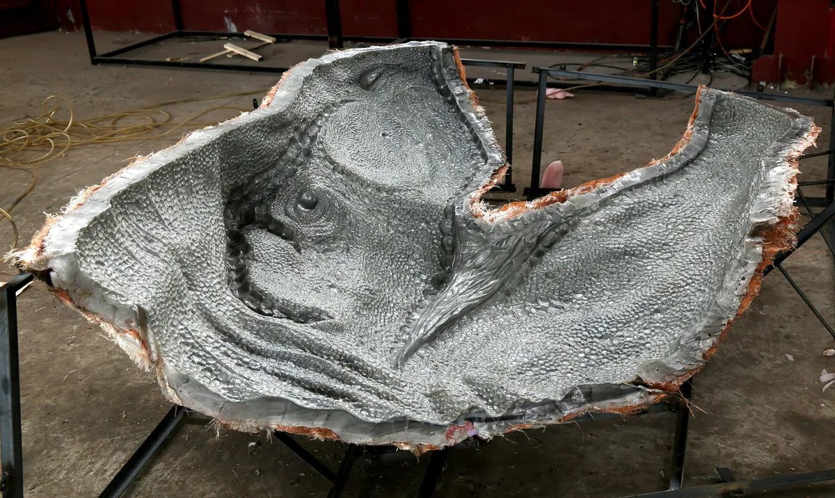Molded silicone skin being cast for an animatronic dinosaur at the HLTDINO workshop