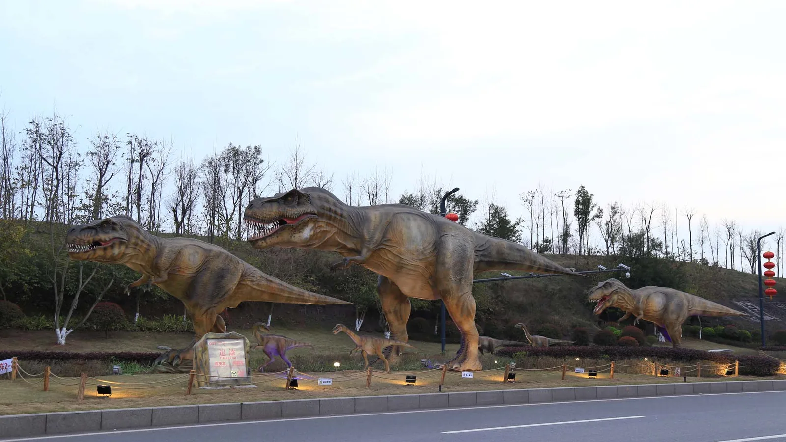 Life-size animatronic T-Rex display with open jaws and full-body motion