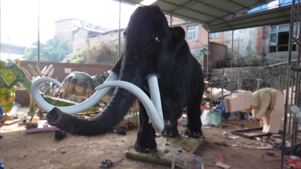 Animatronic woolly mammoth exhibit in an Ice Age museum hall