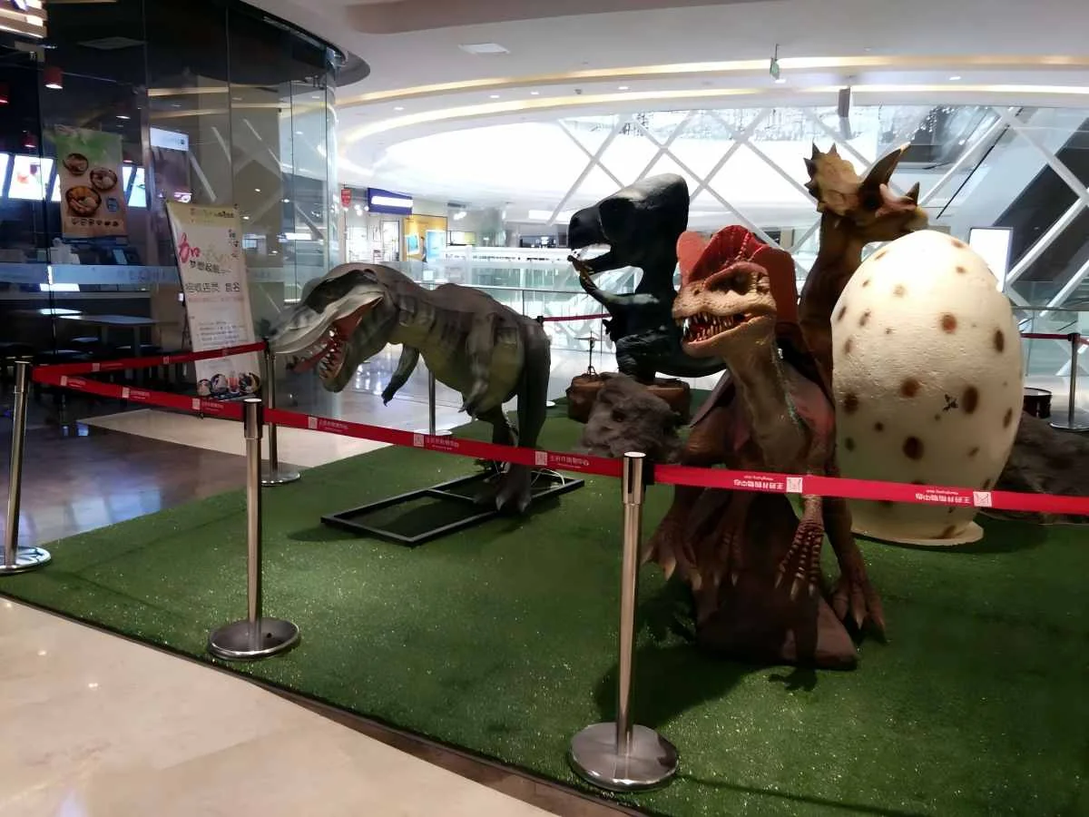 Animatronic dinosaur hatching exhibit used as a commercial event attraction
