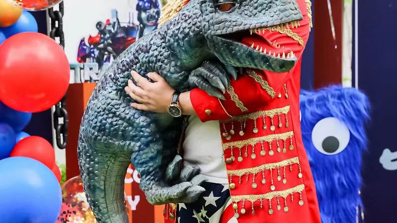Close view of the dinosaur hand puppet head and open jaw