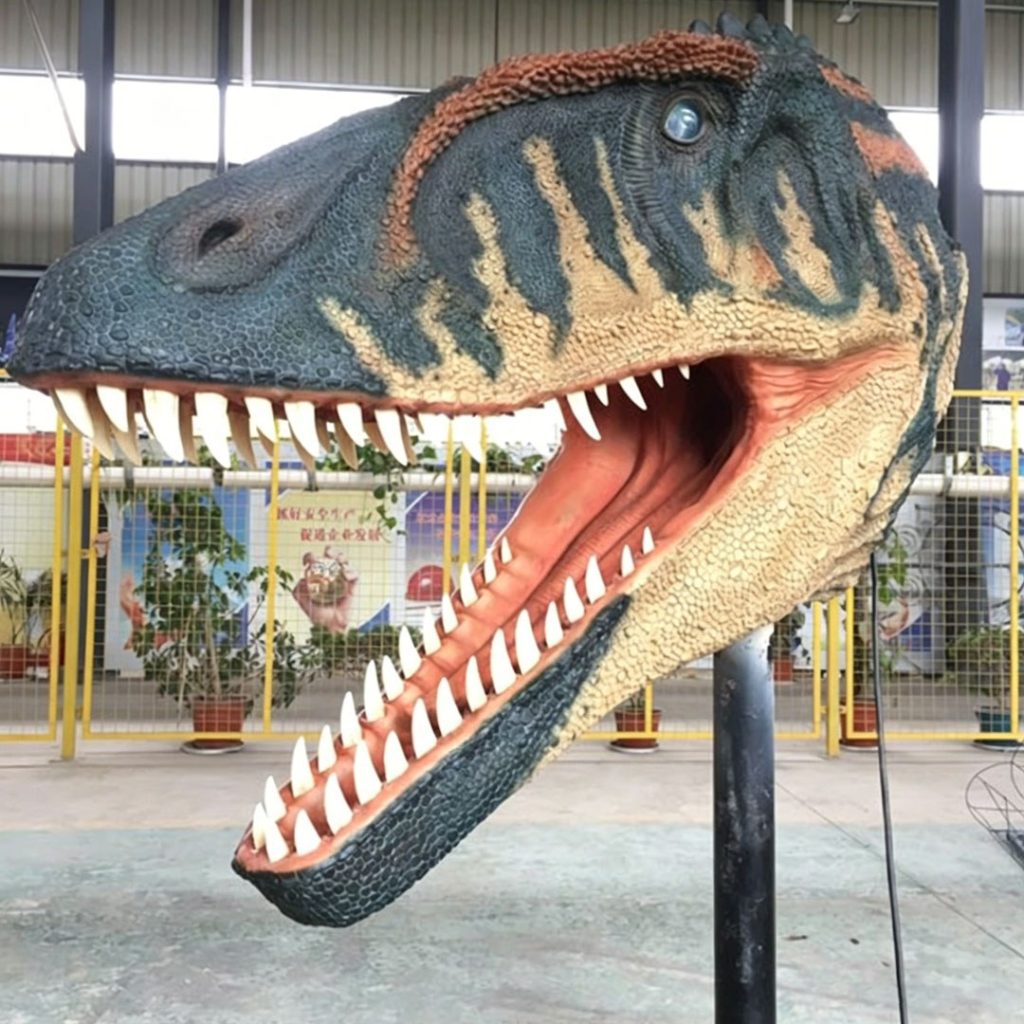 Animatronic Megalosaurus head with jaws wide open showing the full row of recurved teeth