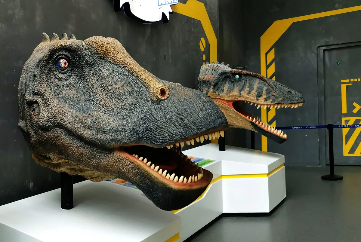 Diplodocus and Carcharodontosaurus animatronic models demonstrating multi-species hand-finished surface manufacturing