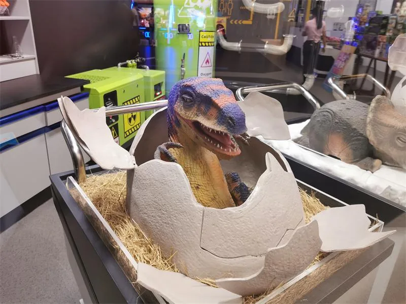 Baby dinosaur animatronic in a shopping mall family zone