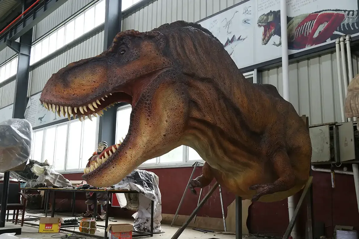 Motion-activated animatronic T-Rex body under construction in the factory
