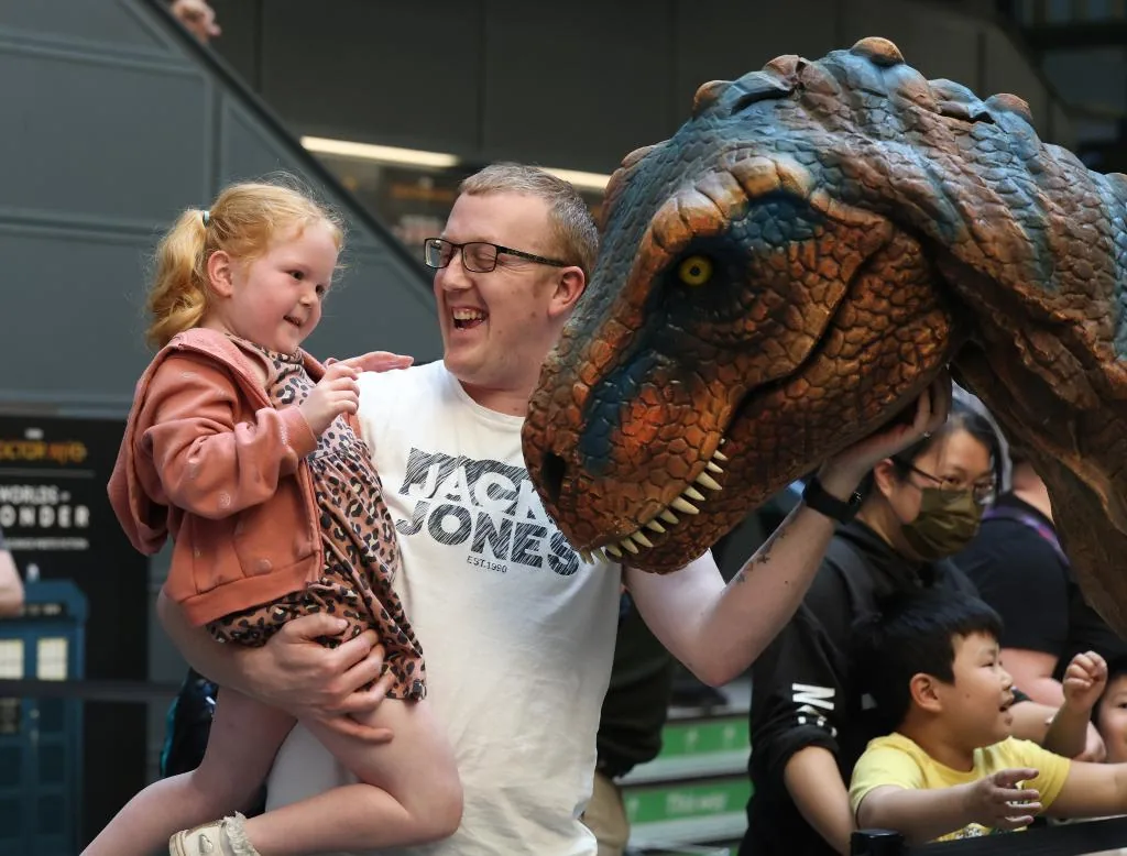 Interactive animatronic dinosaur for families in a museum gallery
