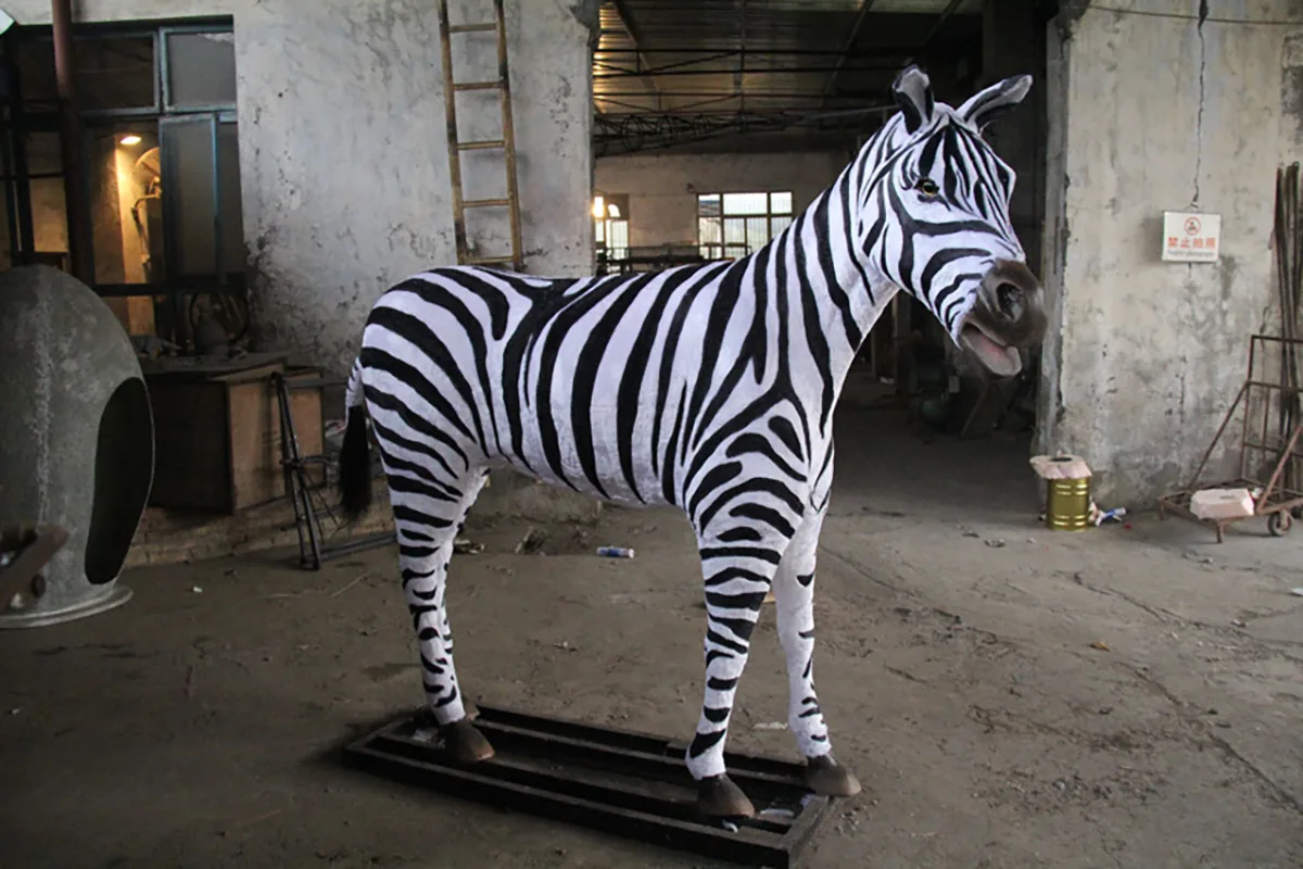 Zebra and foal display with individually painted stripe patterns