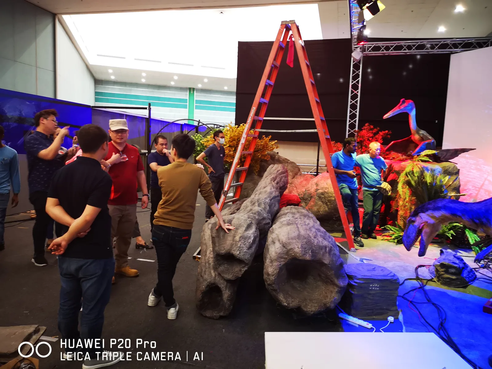 Crew assembling an animatronic exhibit section on site in Singapore
