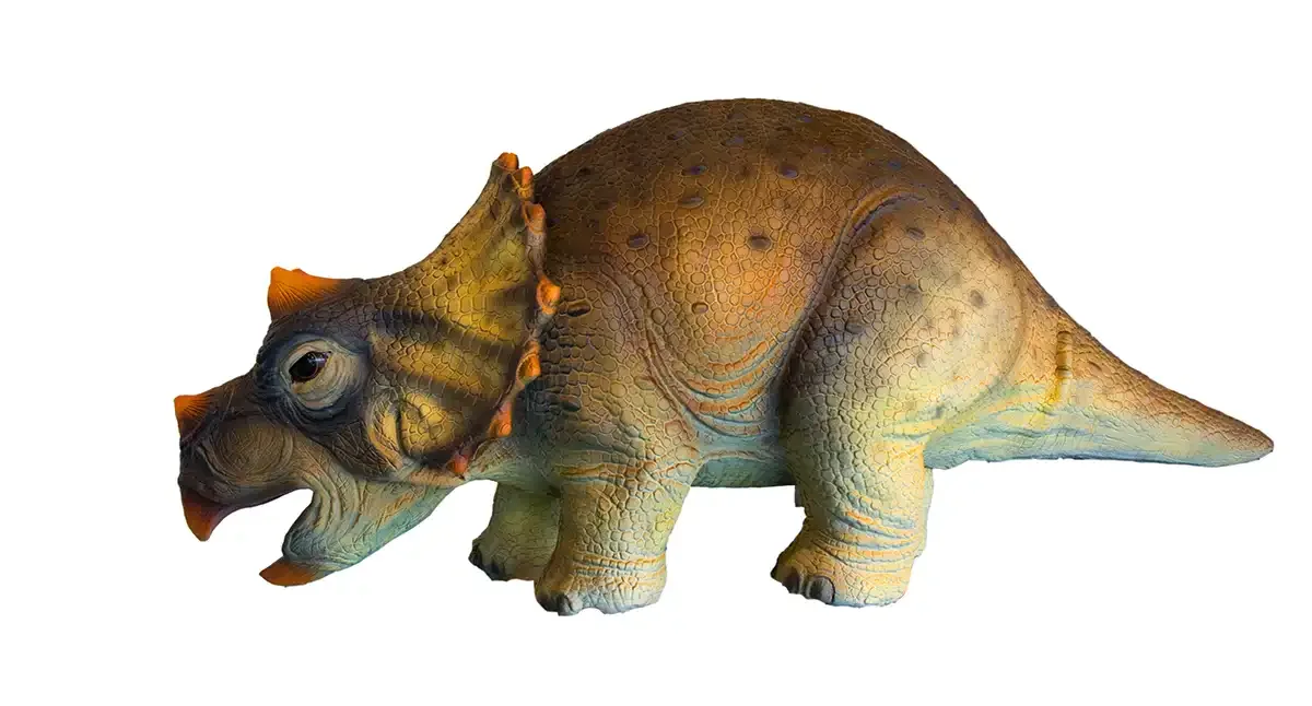 Side view of the cuddly baby triceratops puppet showing body proportion and tail