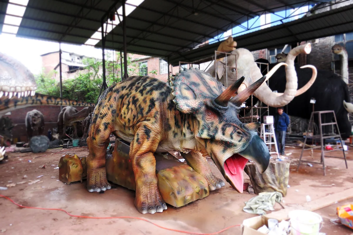 Triceratops ride unit in the workshop with the frill and horns fitted before paint