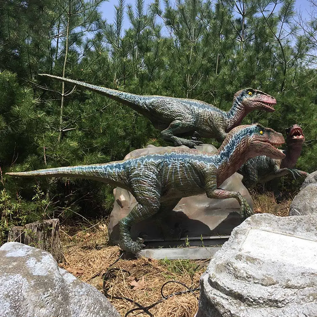 Pack of animatronic Velociraptors arranged as a hunting group display